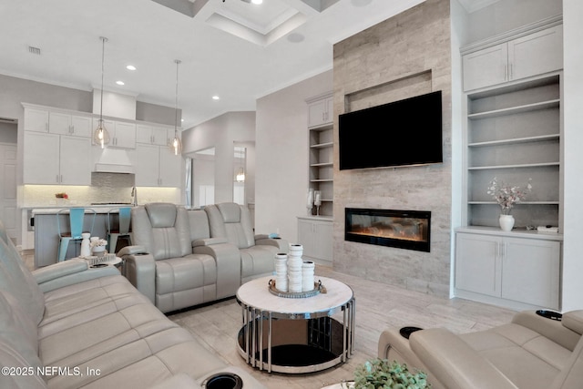 living area featuring a fireplace, ornamental molding, coffered ceiling, and recessed lighting