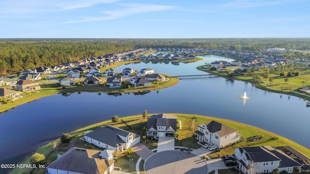 birds eye view of property featuring a water view and a residential view