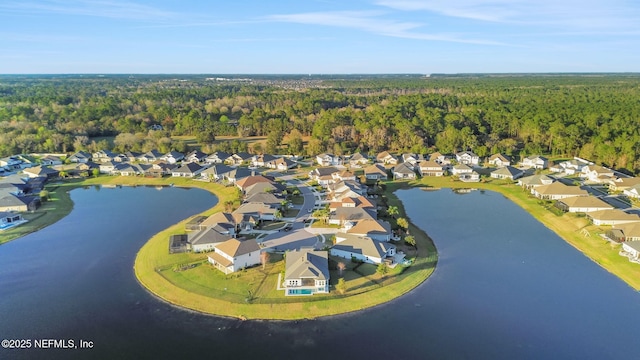 bird's eye view featuring a water view, a residential view, and a view of trees