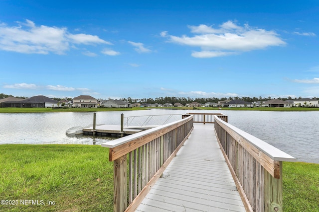 dock area featuring a water view and a residential view