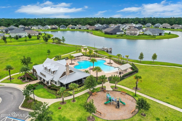 bird's eye view with a residential view and a water view