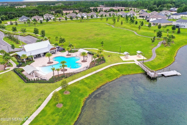 bird's eye view featuring a residential view and a water view