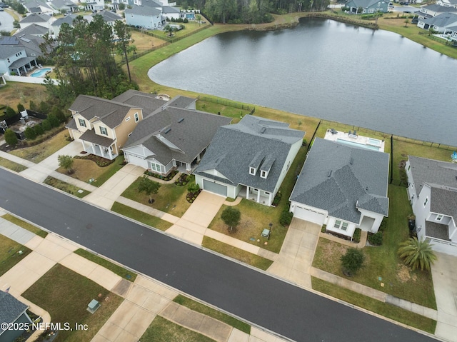 aerial view with a residential view and a water view