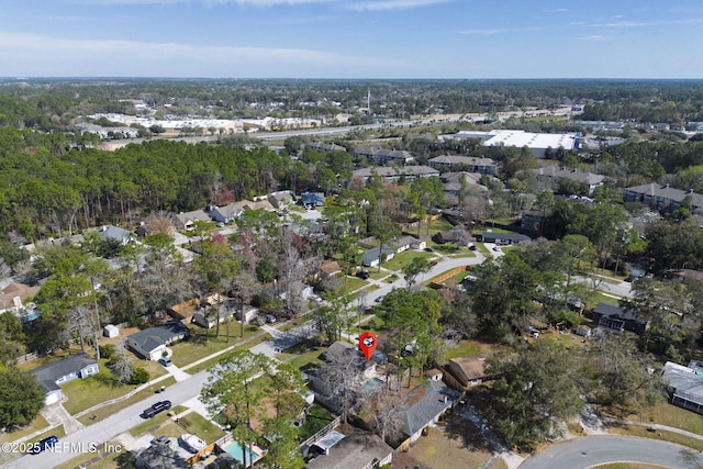 birds eye view of property with a residential view