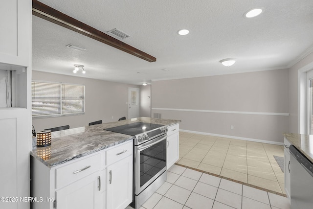 kitchen featuring light tile patterned floors, stainless steel appliances, visible vents, and white cabinets