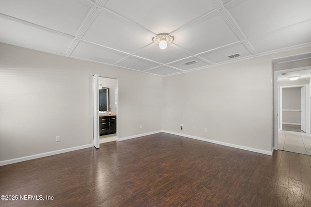 unfurnished living room with wood finished floors, visible vents, and baseboards