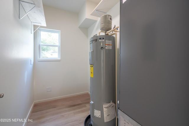 utility room with electric water heater