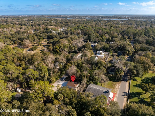 bird's eye view featuring a wooded view