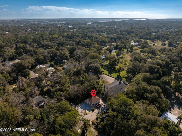 bird's eye view featuring a forest view