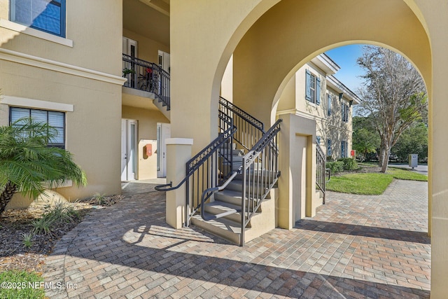 entrance to property with stucco siding