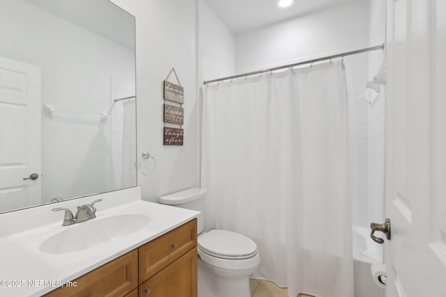 bathroom featuring toilet and vanity