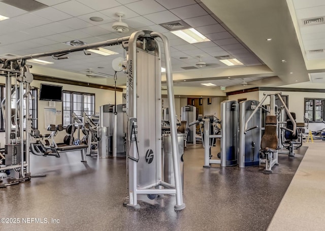 exercise room featuring visible vents and a drop ceiling