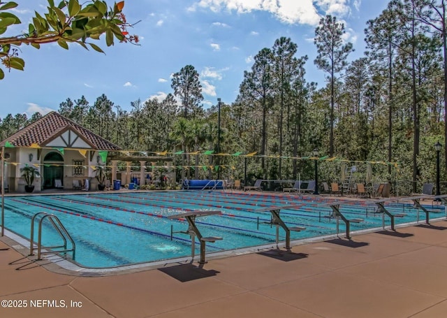 community pool featuring fence