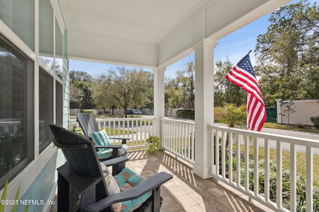 balcony featuring a porch