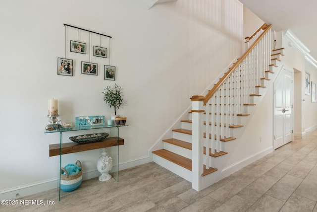 stairs featuring baseboards