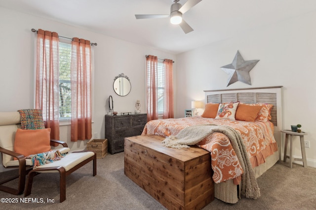 carpeted bedroom featuring a ceiling fan and multiple windows