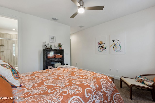 carpeted bedroom featuring visible vents, ceiling fan, and baseboards