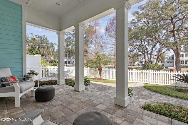 view of patio / terrace featuring fence