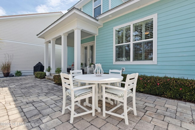 view of patio / terrace featuring outdoor dining space and french doors