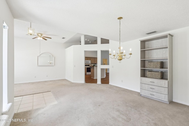 interior space with visible vents, carpet, vaulted ceiling, a textured ceiling, and ceiling fan with notable chandelier