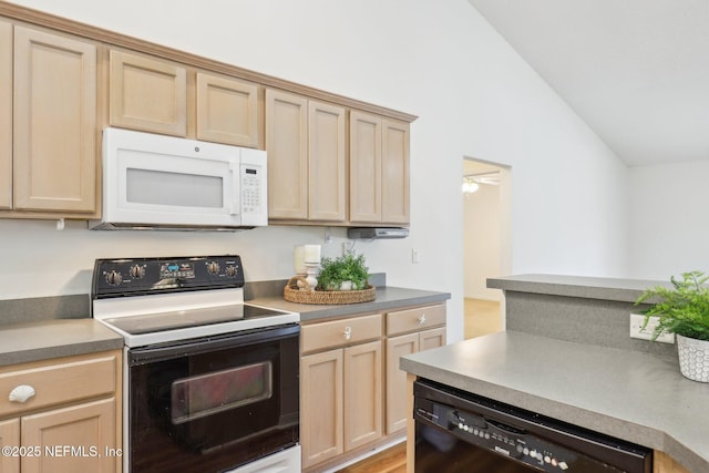 kitchen with lofted ceiling, white microwave, light brown cabinets, electric range, and black dishwasher