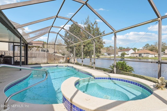 view of pool featuring glass enclosure, a patio, a water view, fence, and a pool with connected hot tub