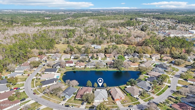 drone / aerial view featuring a residential view and a water view