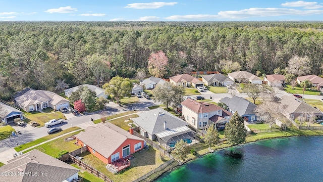 birds eye view of property with a residential view, a water view, and a forest view