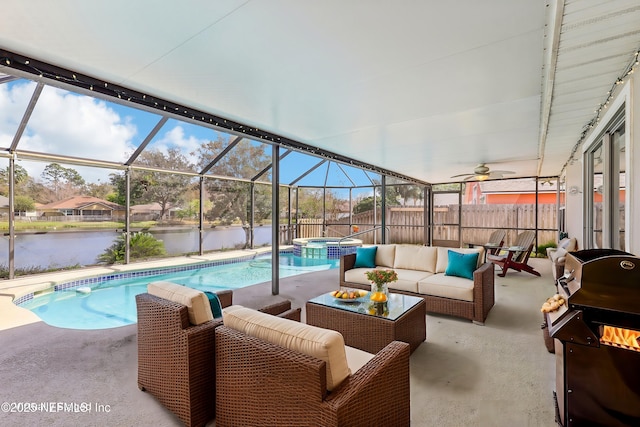 sunroom with a water view and a swimming pool