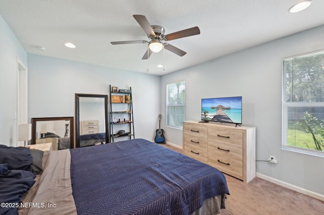 bedroom with recessed lighting, baseboards, a ceiling fan, and light colored carpet