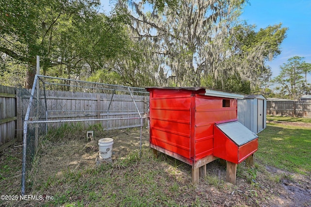 view of shed with a fenced backyard