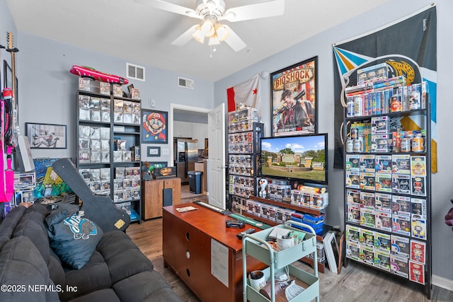 game room featuring ceiling fan, visible vents, and wood finished floors