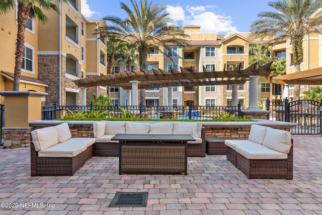 view of patio with a residential view, an outdoor living space, and a pergola