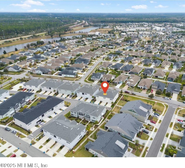 bird's eye view with a residential view and a water view