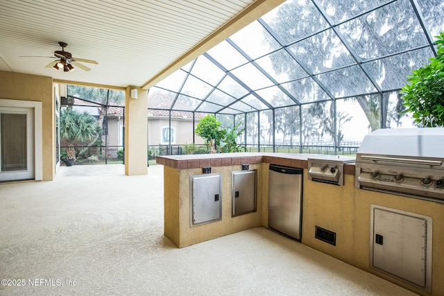 view of patio with glass enclosure, a ceiling fan, and area for grilling