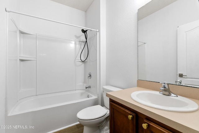 bathroom featuring toilet, washtub / shower combination, and vanity