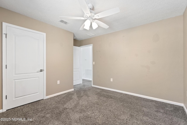 unfurnished bedroom featuring carpet, visible vents, and baseboards