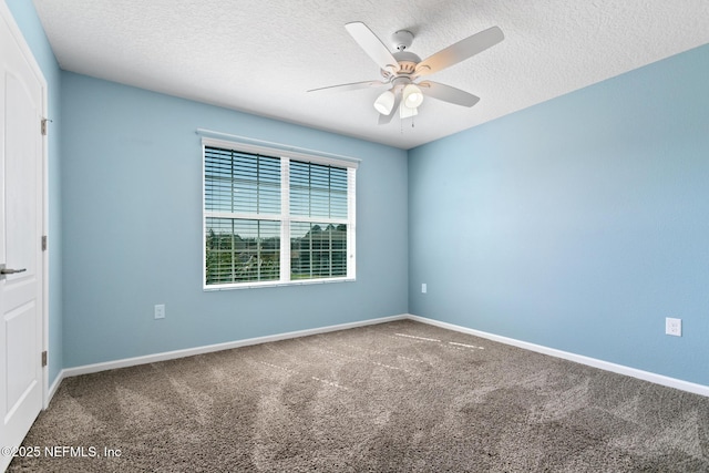 unfurnished room featuring ceiling fan, carpet floors, a textured ceiling, and baseboards