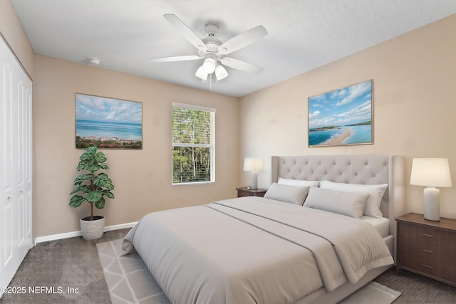 bedroom featuring a ceiling fan, carpet, baseboards, and a closet