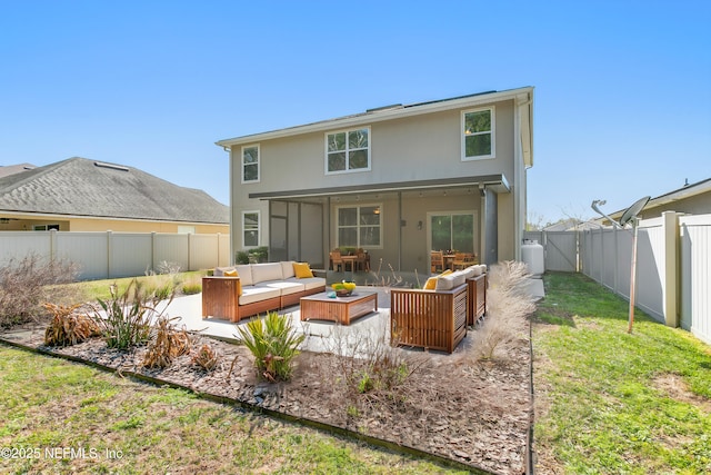 rear view of property with a fenced backyard, an outdoor living space, a yard, stucco siding, and a patio area