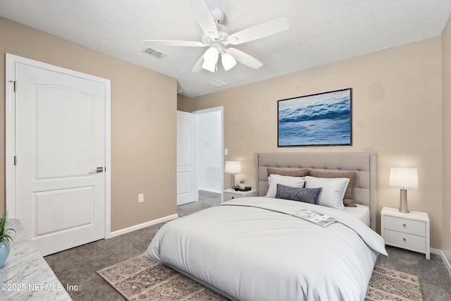 carpeted bedroom with visible vents, baseboards, and a ceiling fan