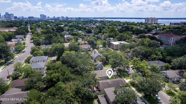 birds eye view of property with a city view and a water view