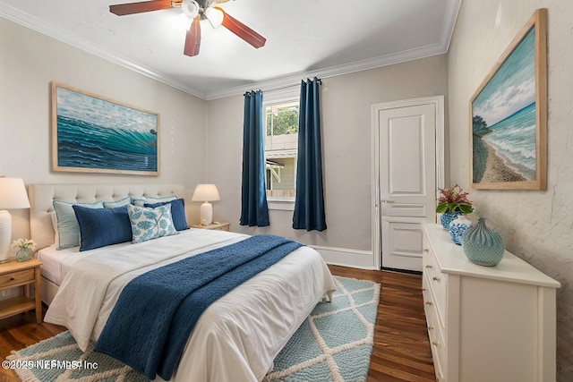 bedroom with crown molding, baseboards, ceiling fan, and dark wood-type flooring