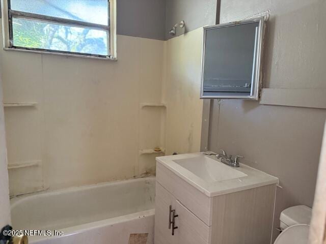 full bathroom with bathtub / shower combination, vanity, and toilet