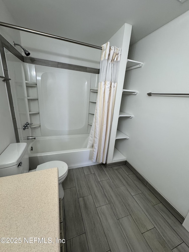 full bathroom featuring shower / tub combo, toilet, and wood tiled floor