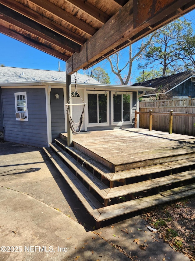 wooden deck featuring fence