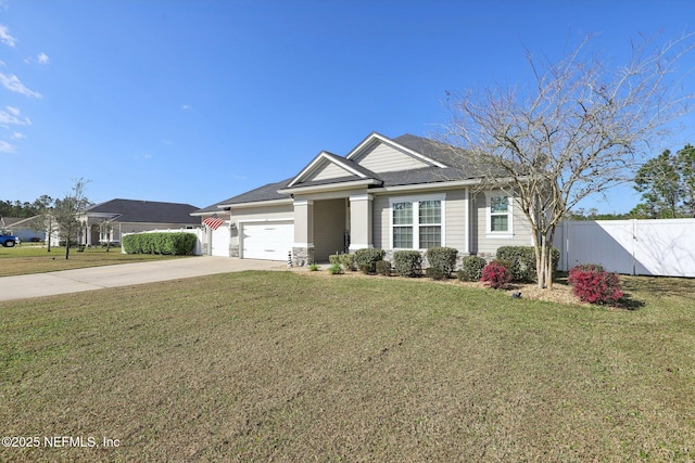 view of front of home featuring concrete driveway, an attached garage, a gate, fence, and a front lawn