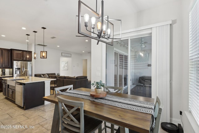 dining area featuring a chandelier and recessed lighting