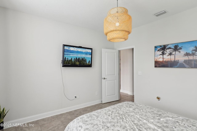 bedroom featuring visible vents, baseboards, and tile patterned floors