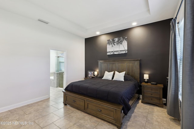 bedroom featuring a raised ceiling, visible vents, baseboards, and light tile patterned floors